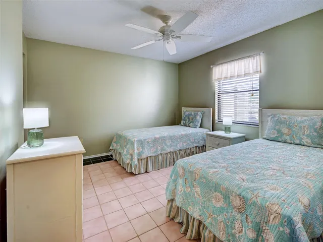 GUEST BEDROOM WITH BUILT-IN CLOSET.