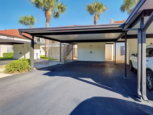 DESIGNATED COVERED CARPORT AND STORAGE CLOSET.