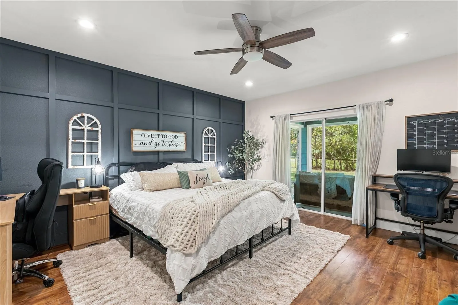 Primary Suite with sliders to access the covered patio