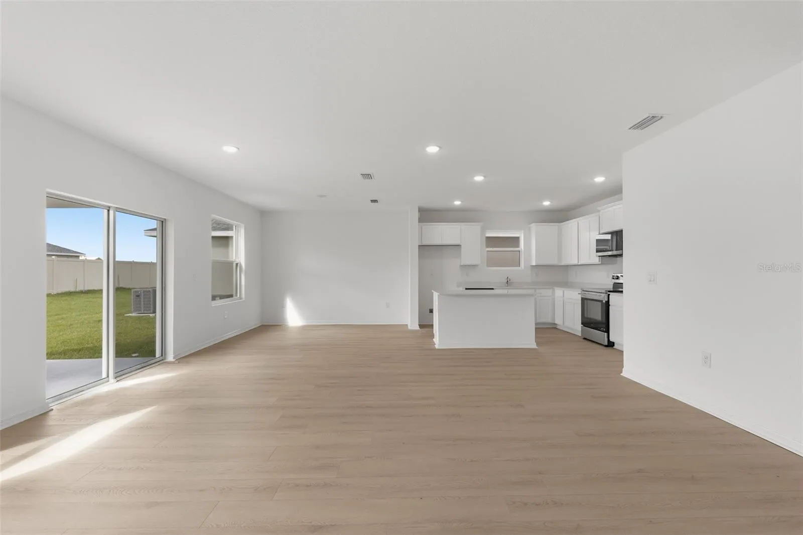 Open concept living, dining, and kitchen