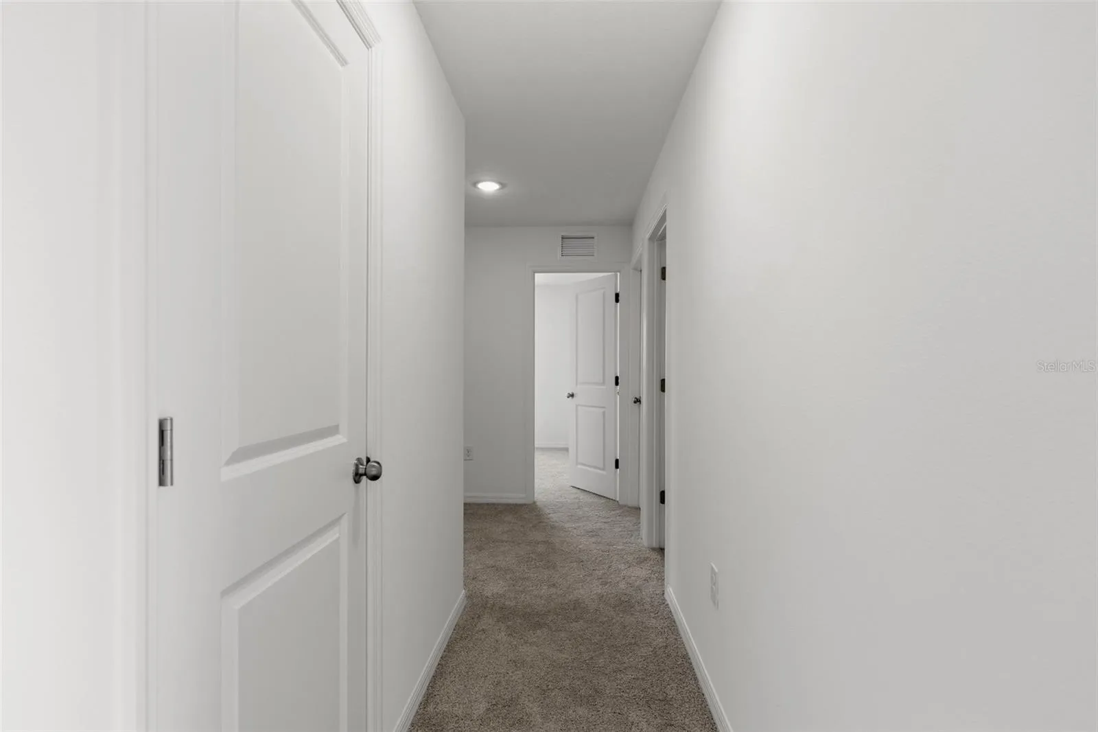Hallway to guest bedrooms and laundry room