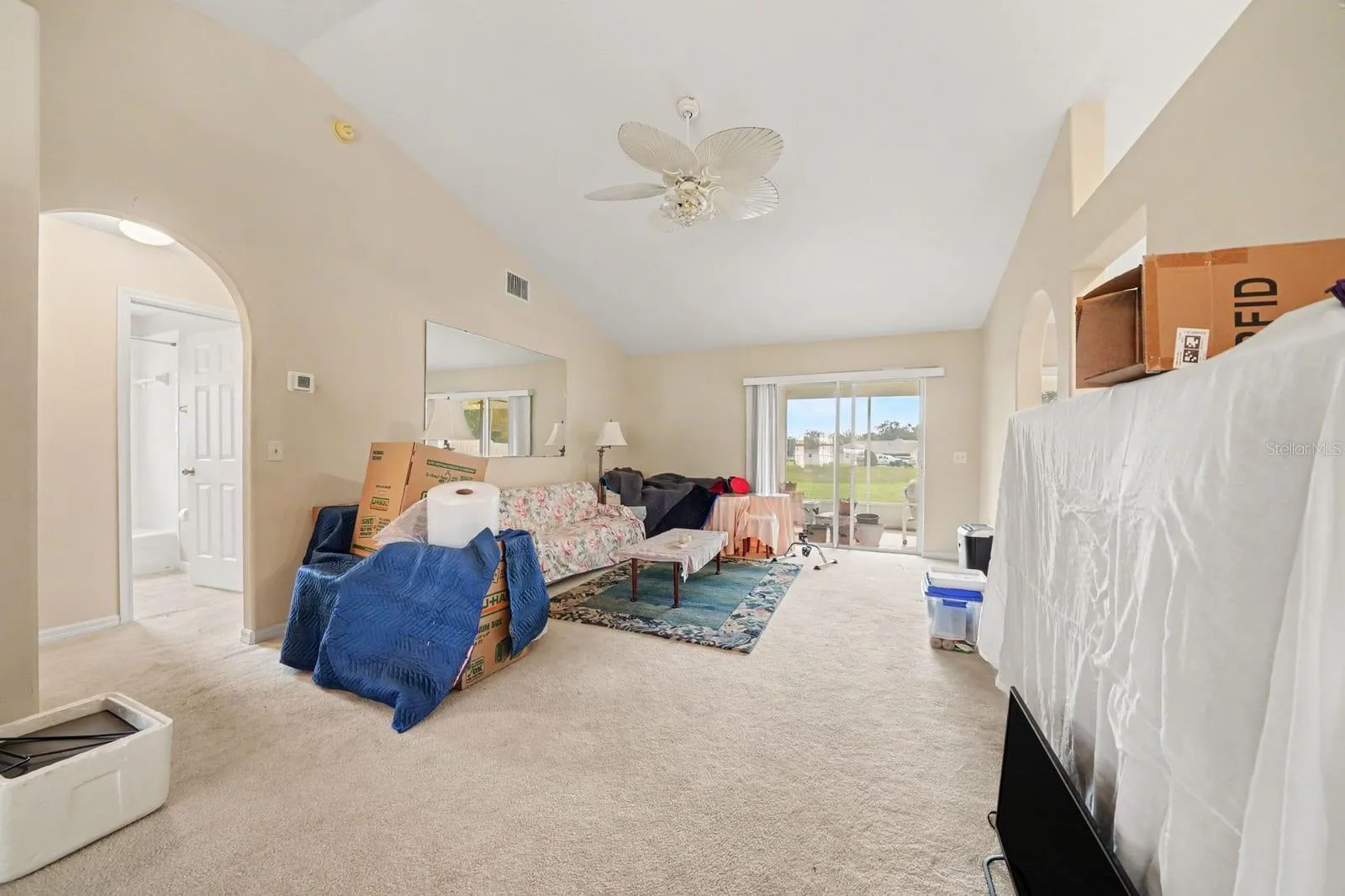 Master bedroom with ceiling fan, window to grounds, and spa-like comfort