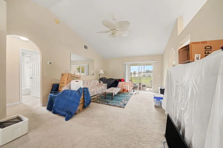 Master bedroom with ceiling fan, window to grounds, and spa-like comfort