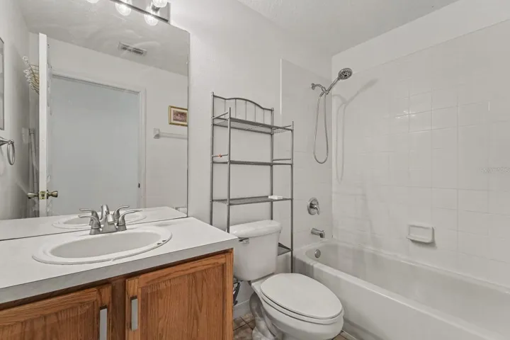 Luxurious Master Bath with Dual Vanity, Garden Tub, Separate Shower, and Decorative Details