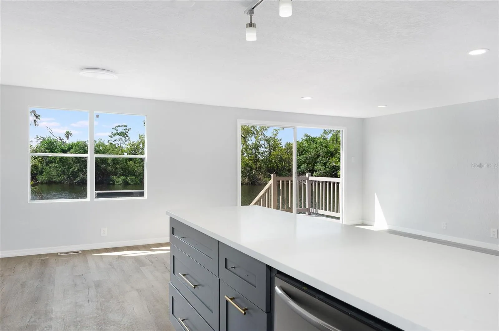 kitchen facing waterfront  via diningroom and livingroom