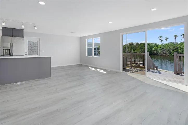 Livinroom facing kitchen island  east and waterfront