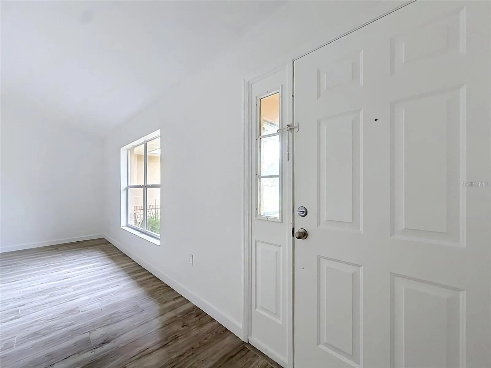 Step inside to natural light and wood-look flooring.