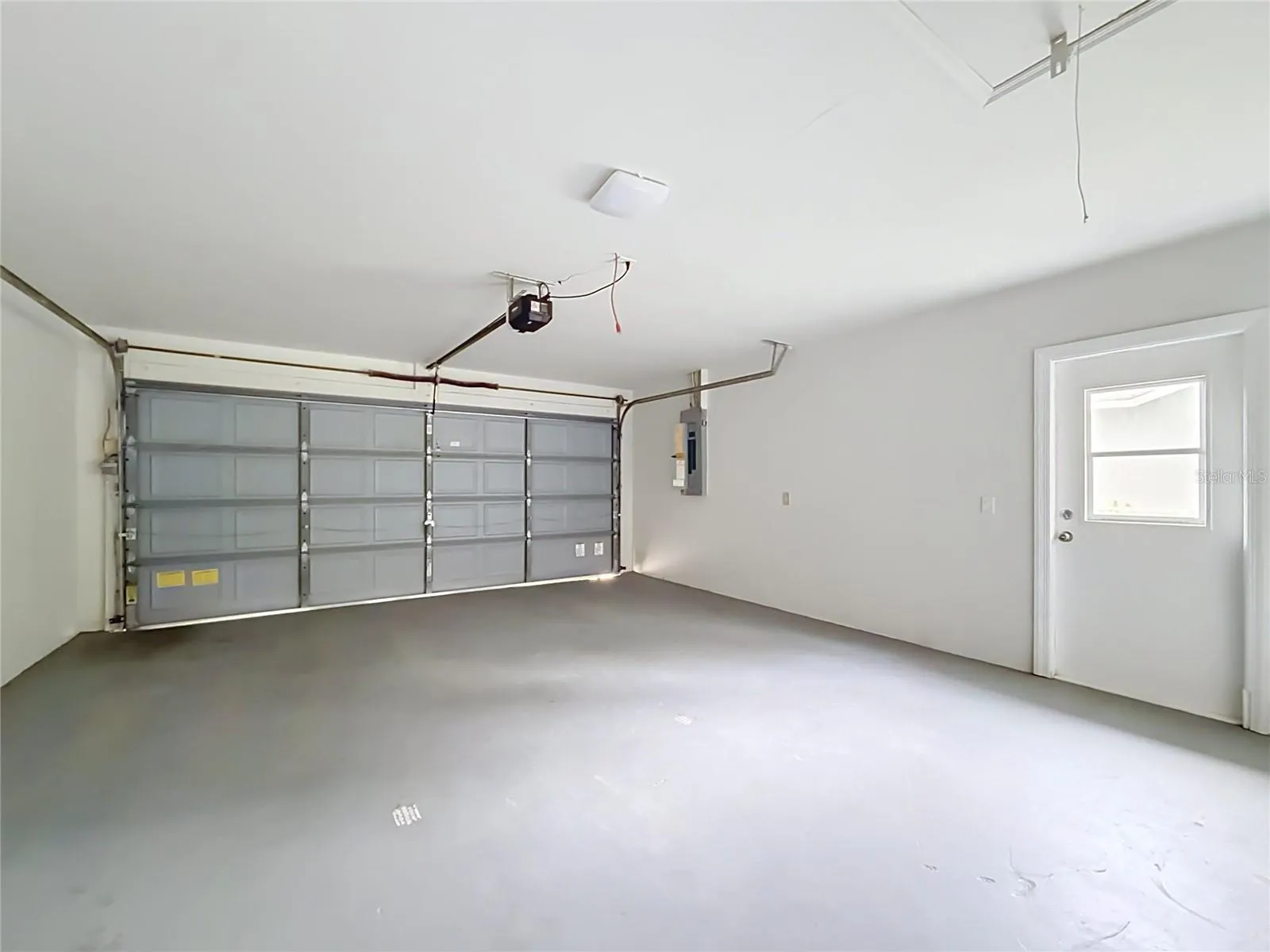 Two-car garage with room for parking and storage.