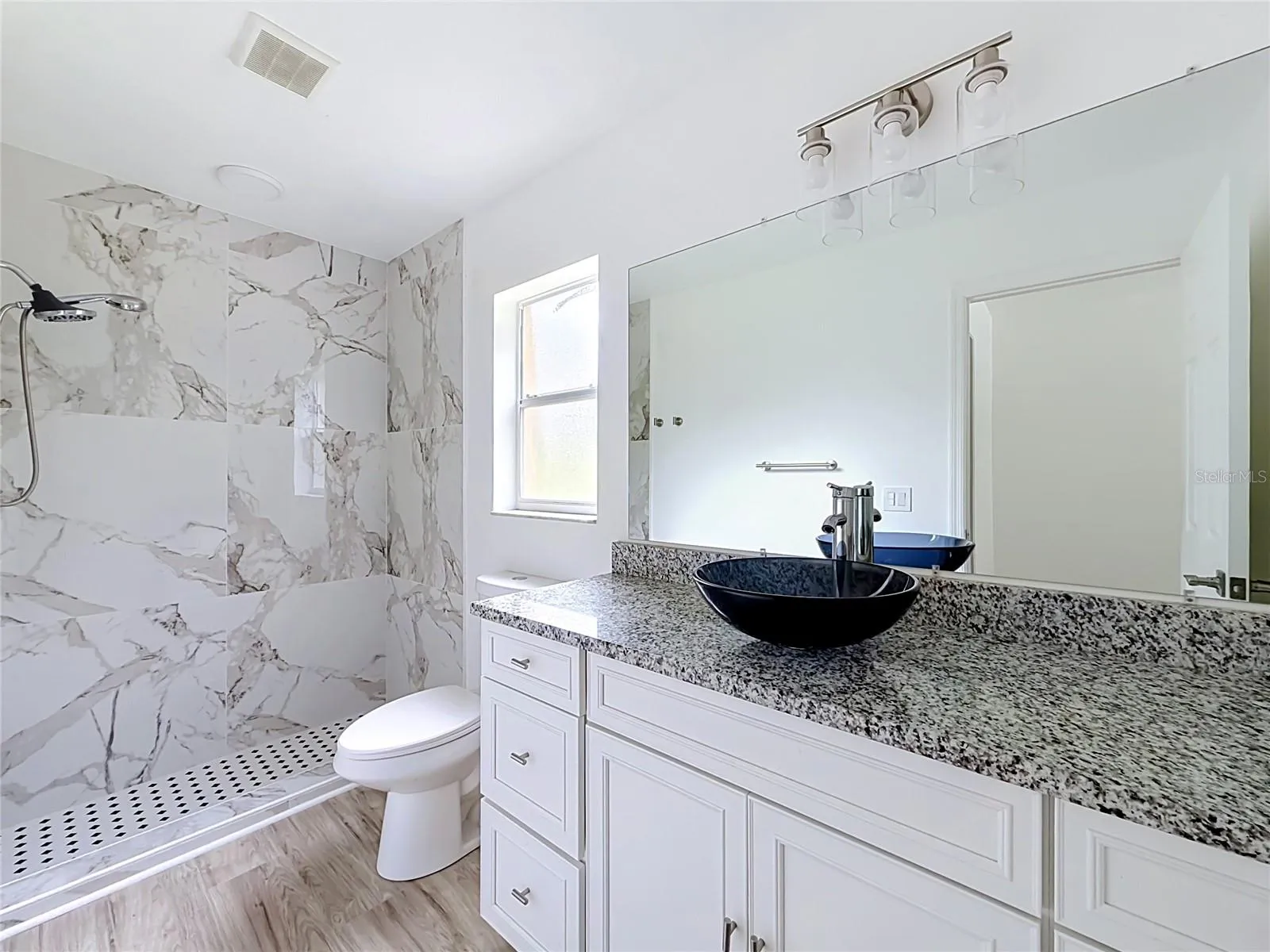 A tiled walk-in shower adds style to your daily routine.