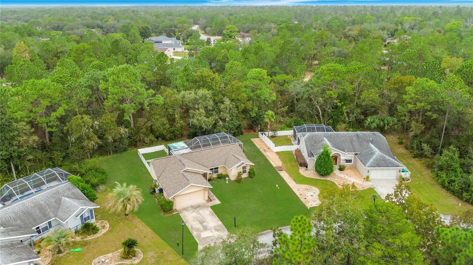 No rear neighbors and a lush wooded backdrop.