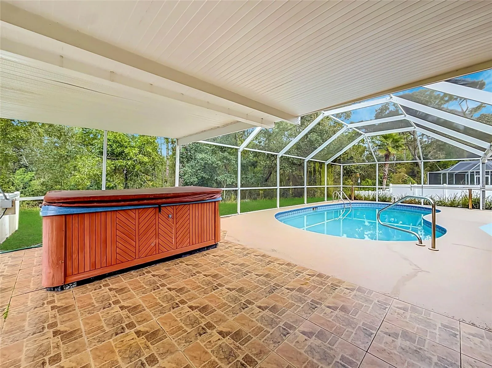 Your shaded retreat beside a private screened pool