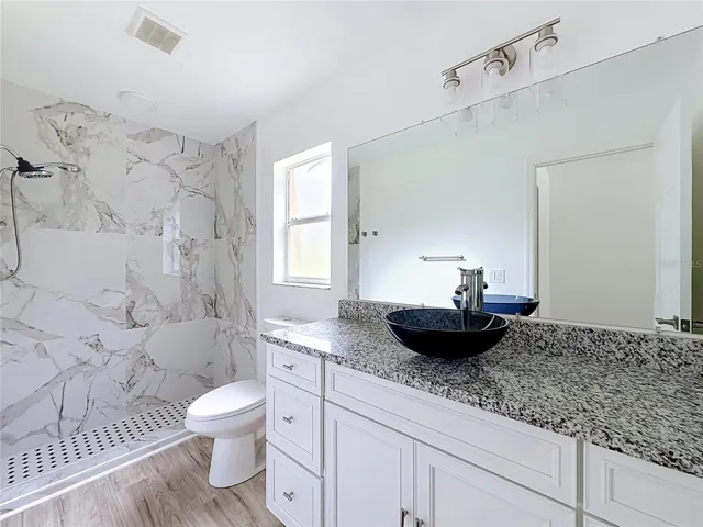 A tiled walk-in shower adds style to your daily routine.