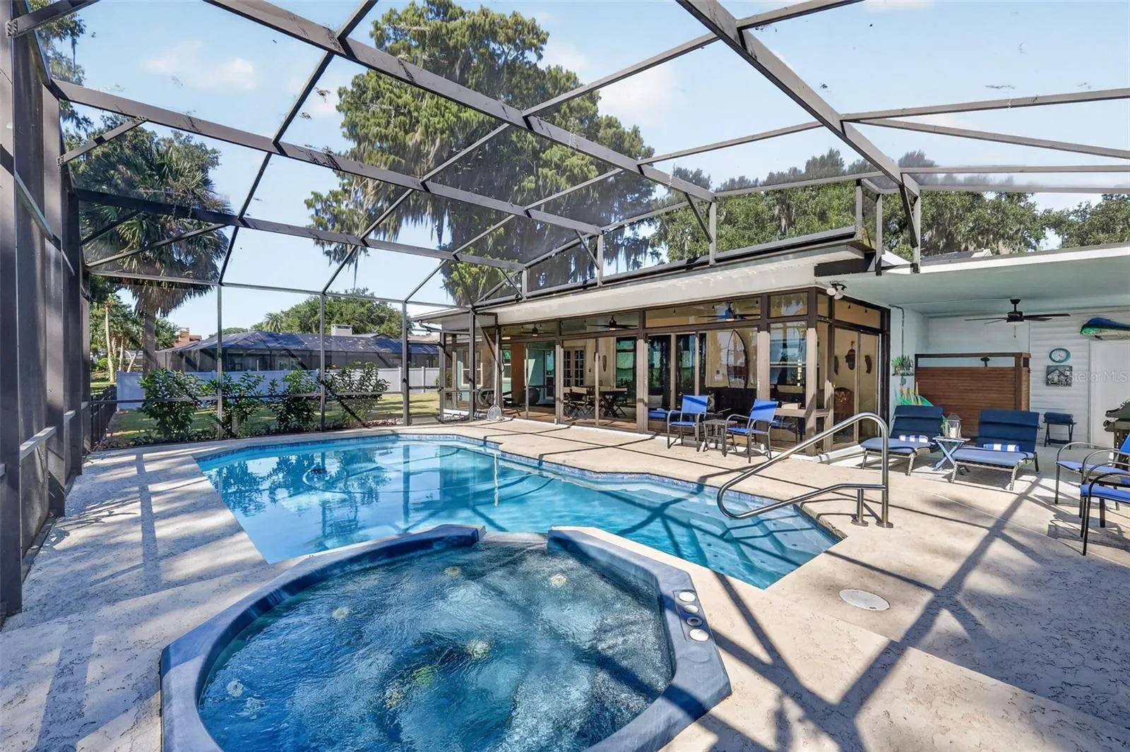 Hot tub, pool, lanai; note the space to the right; outdoor shower..