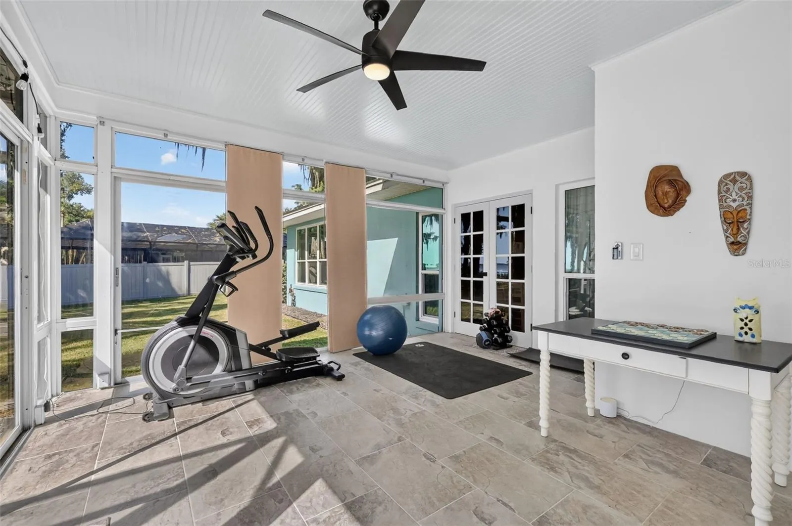 The French doors lead to the den/office