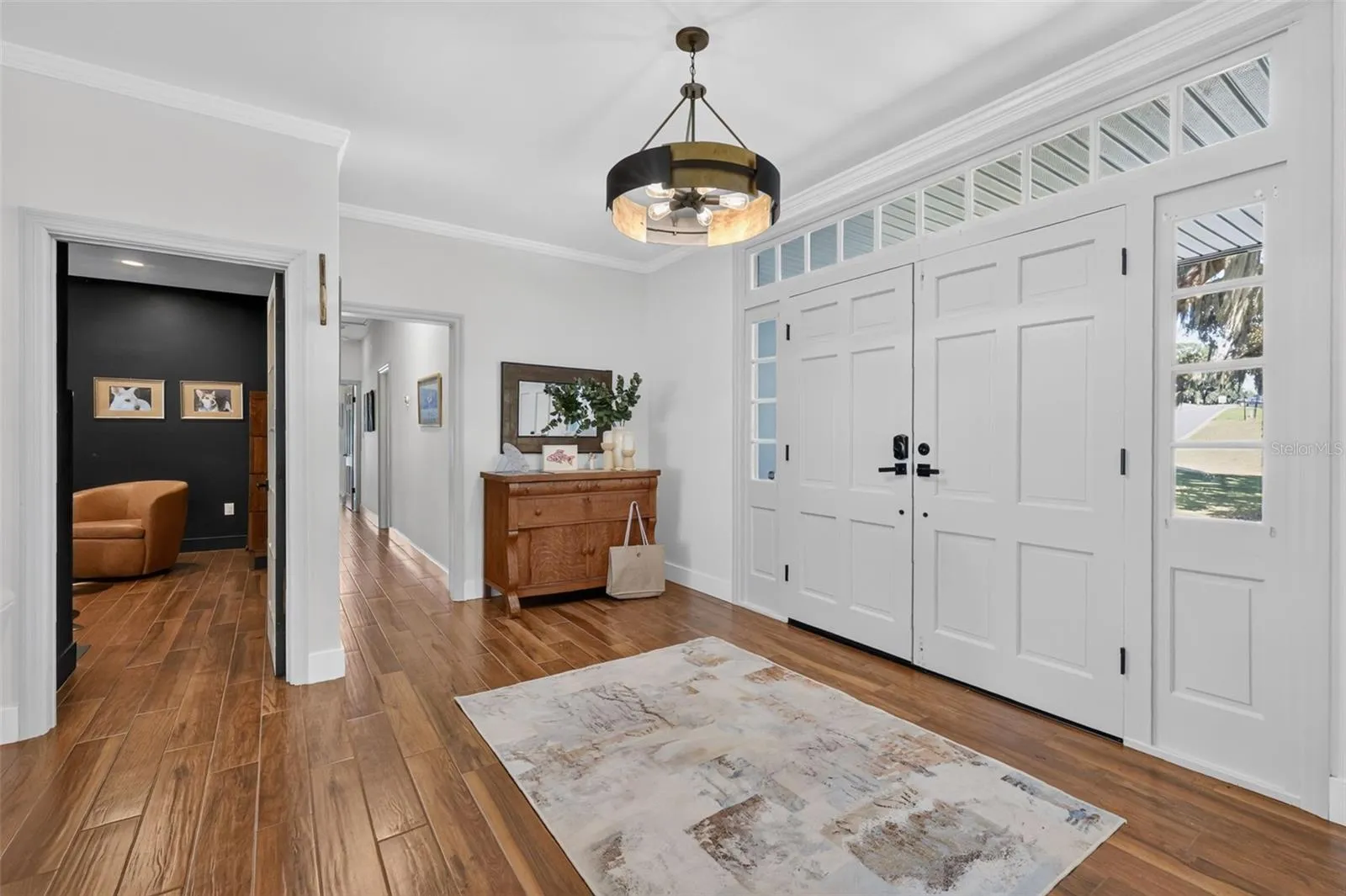 Double door entry into foyer; office/den shown; hall to bedrooms as well