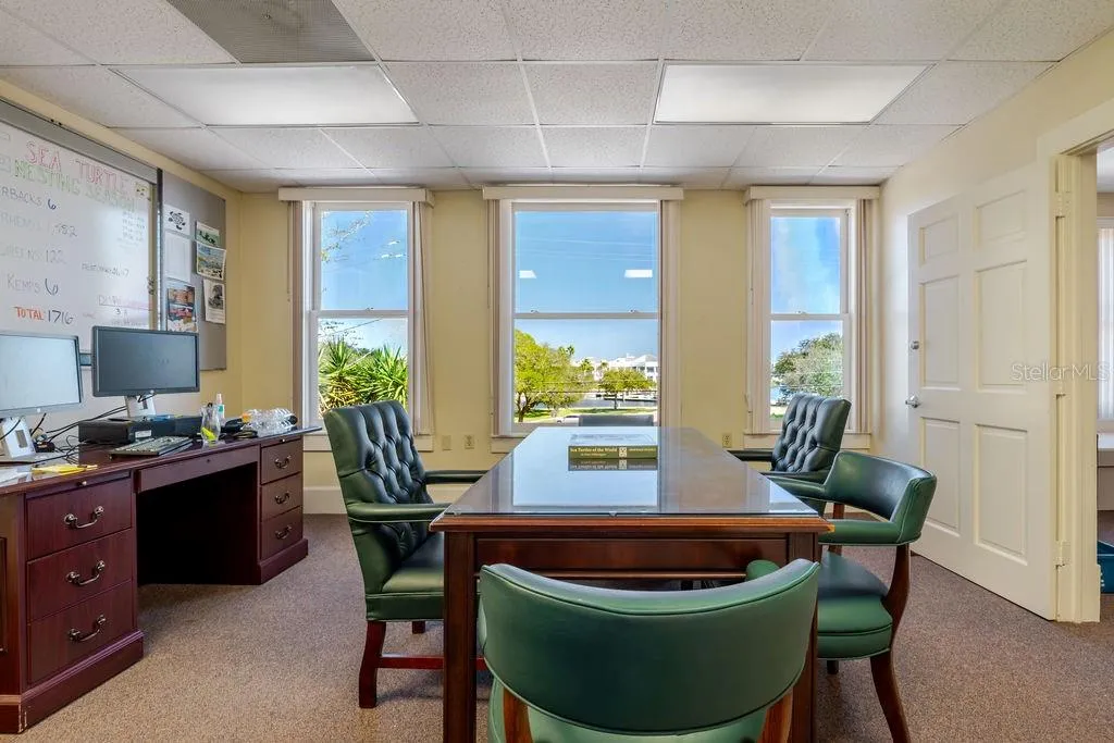 Second floor office and conference area with historic doors.