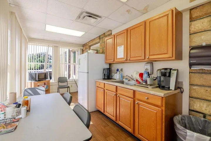 First floor kitchen with wrap around windows and exterior access.