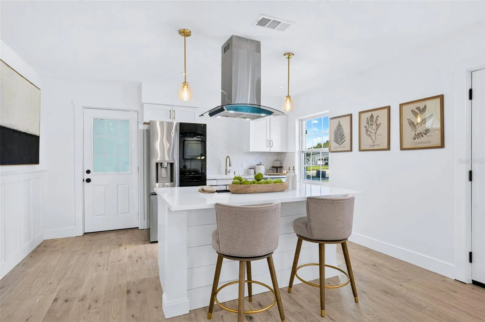 This kitchen island has electric in the island with custom shiplap backing.