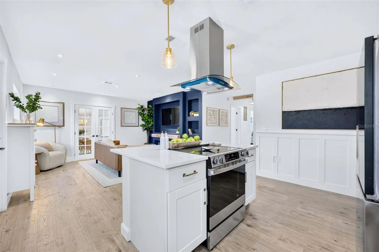 Gold pendant lights give the pop of color and also the bling factor as well to add to the overall look of this home.
