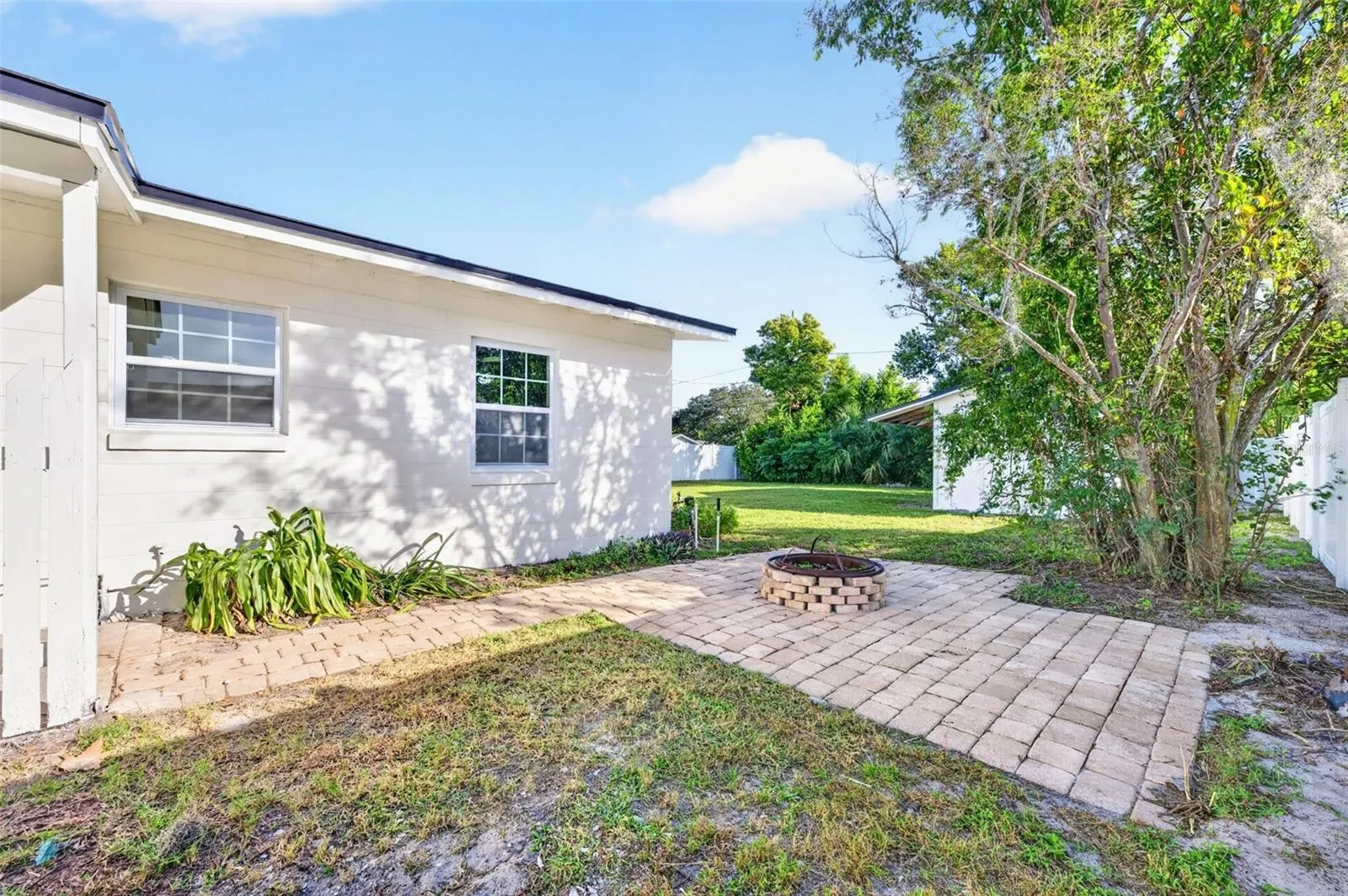Right off the laundry room is the side lot with a fireplace to cozy up and relax after those stressful days.