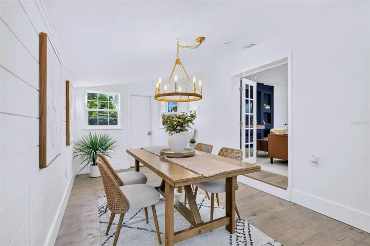 Gorgeous chandelier with links and a hook, to be moveable depending on the size of the owners dining table.