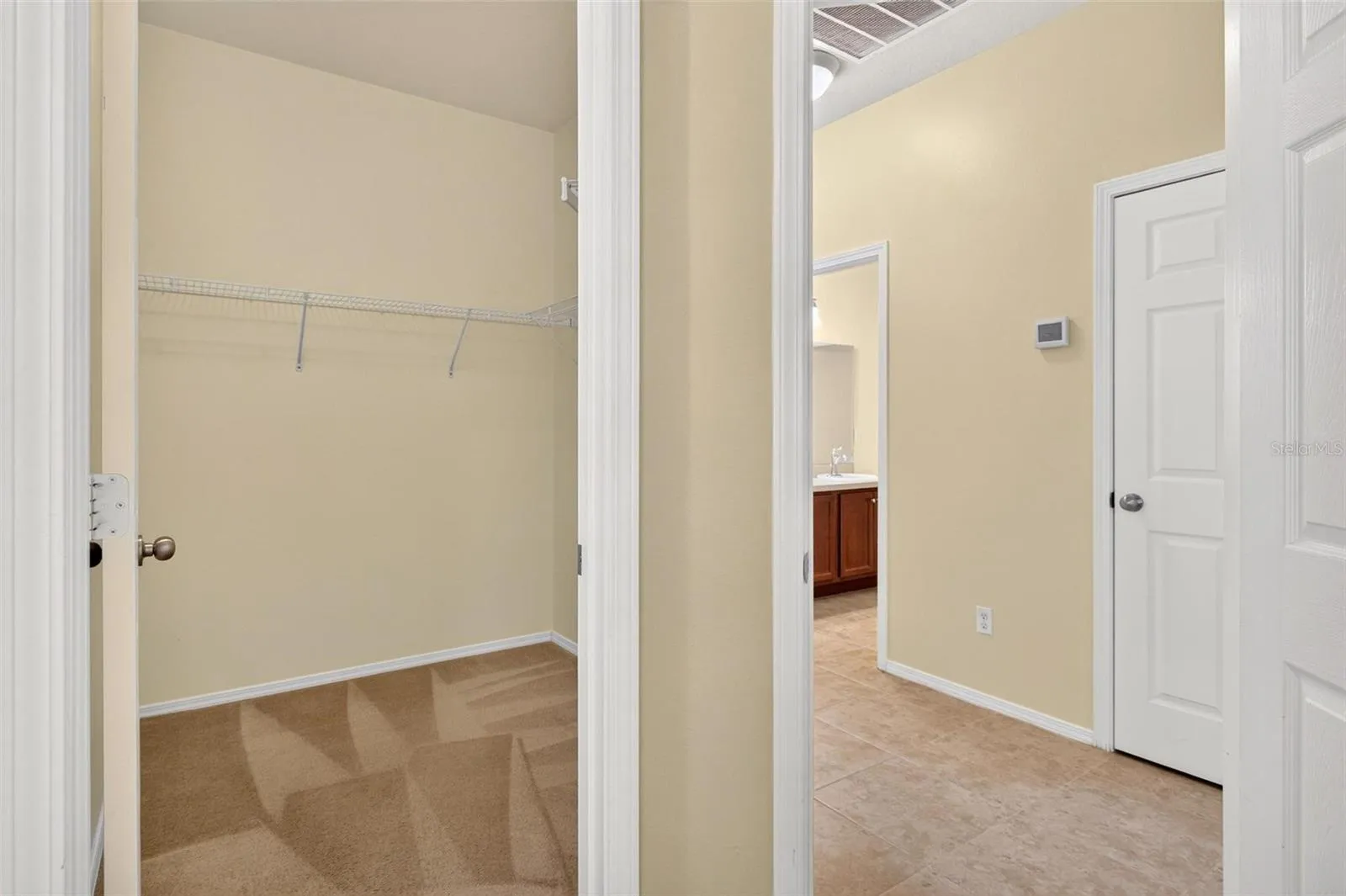 Primary Closet/ Entrance to Primary Bedroom