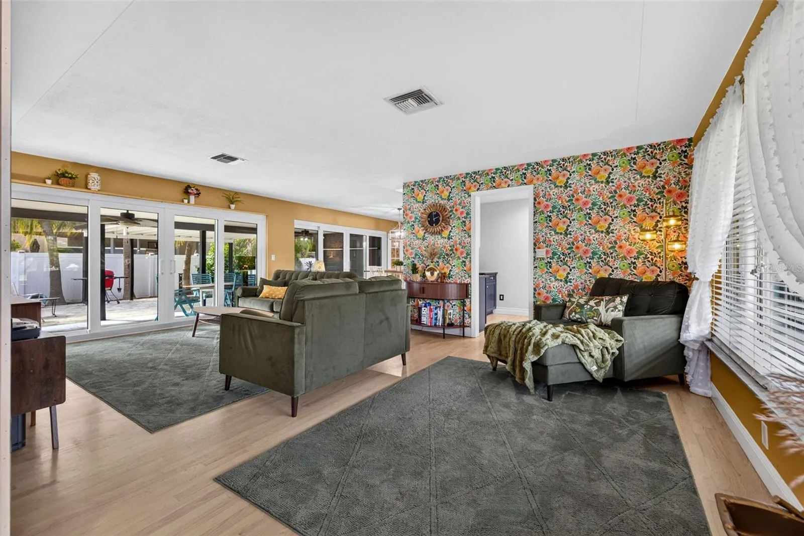 Foyer and living room with sliders to back porch