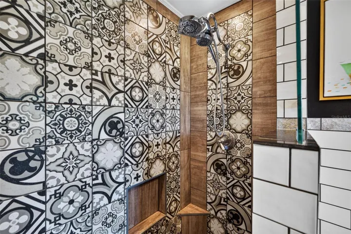 Primary bathroom with stand alone clawfoot tub, double shower head walk in shower, and double sink vanity
