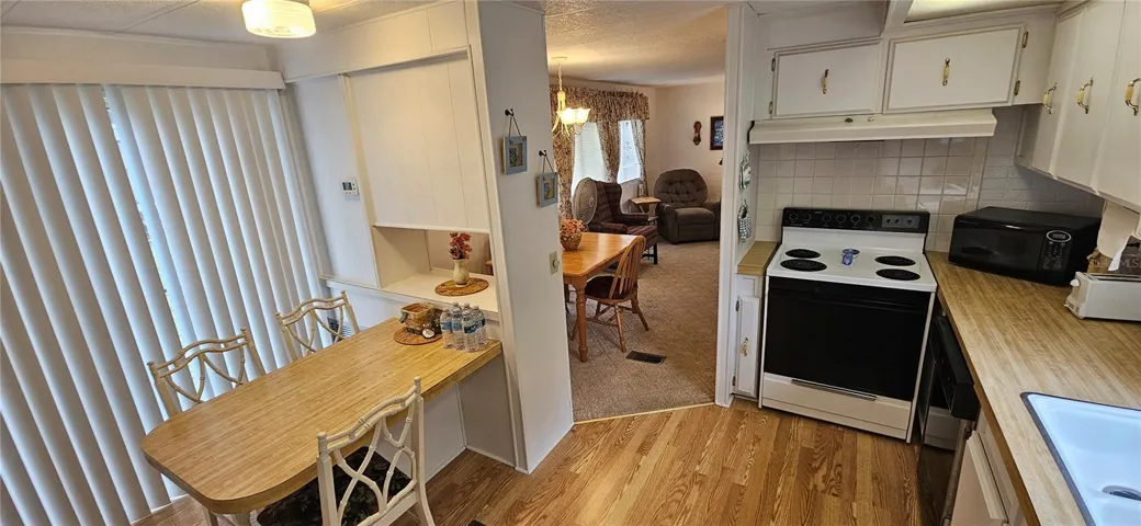 Kitchen showing table and sliding glass door