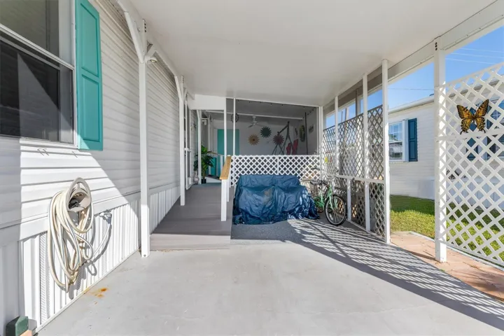 Carport, ramp to front door and lanai