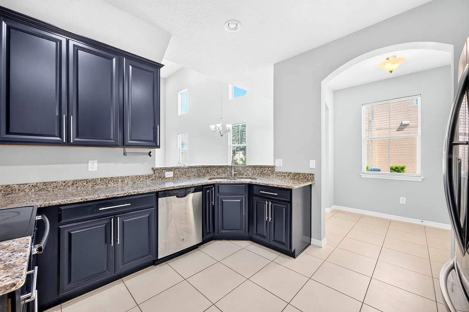 The Kitchen is both beautiful and functional, featuring 42-INCH CABINETRY, GRANITE COUNTERTOPS AND STAINLESS STEEL APPLIANCES.