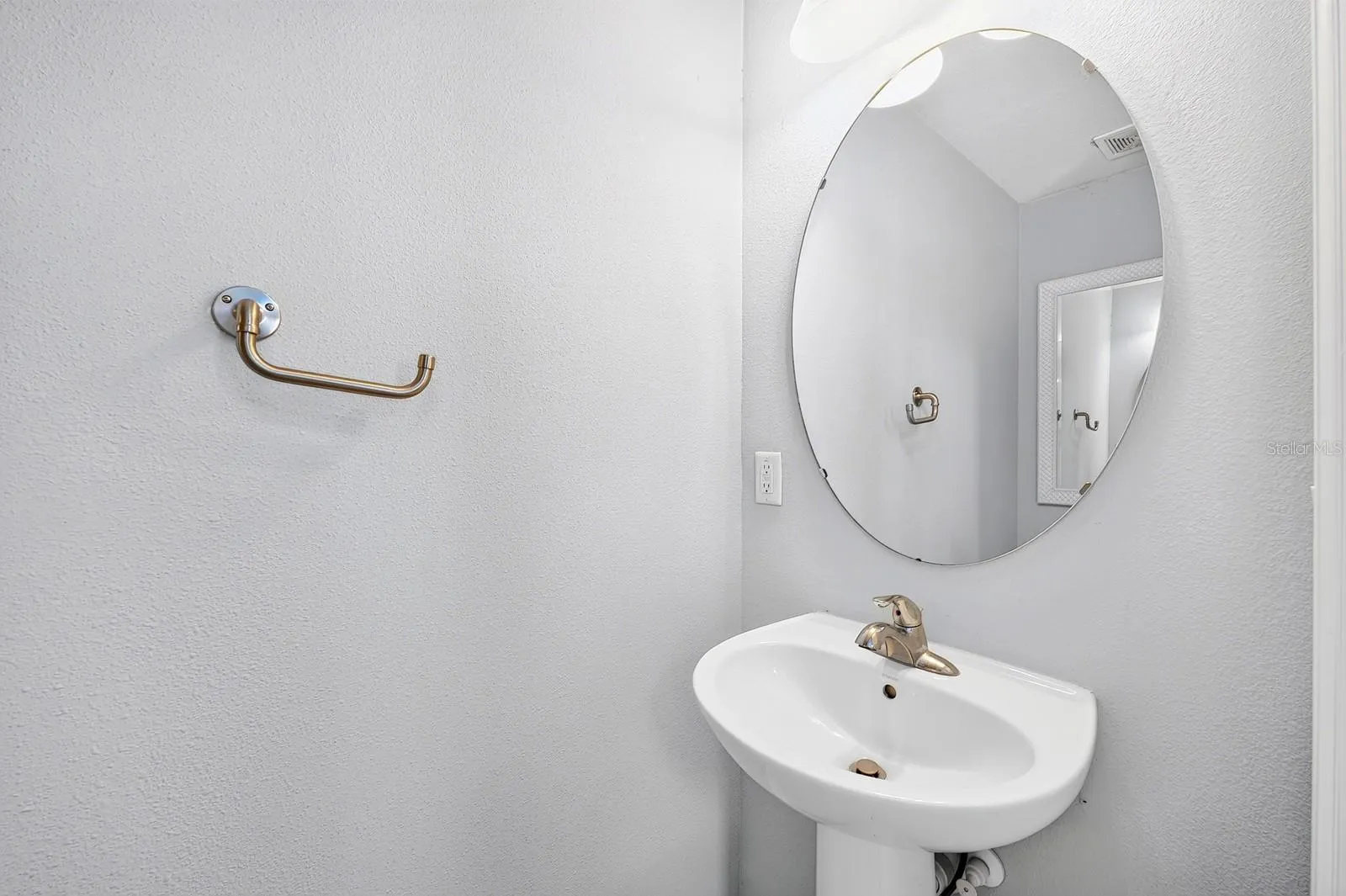 A convenient Half Bath serves guests and family.