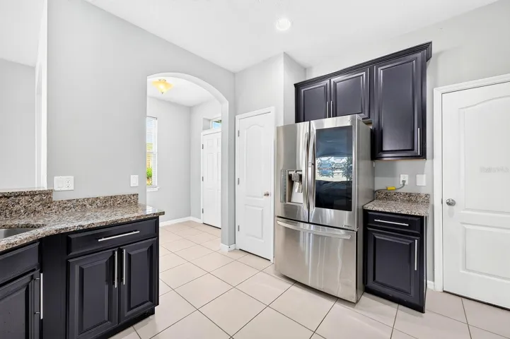 A closet pantry offers convenient storage, while the BREAKFAST BAR provides a natural place for casual meals, conversation or keeping the cook company.
