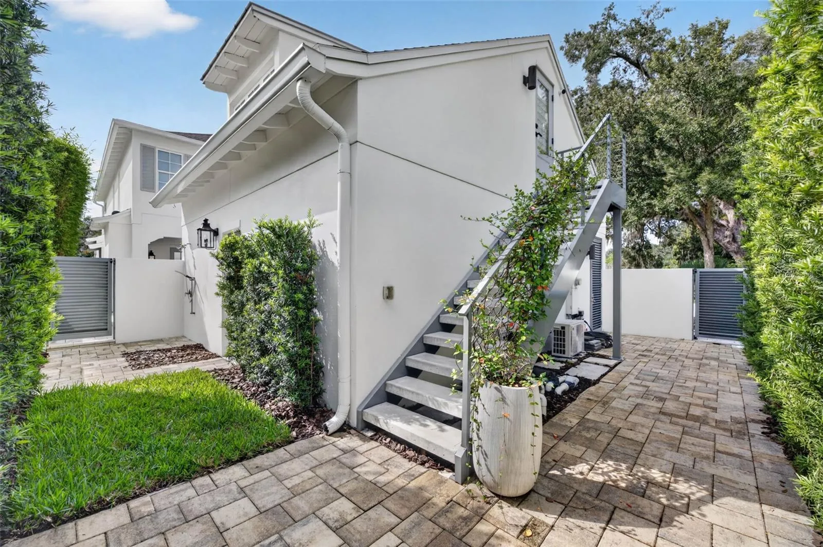 Outdoor shower and upgraded concrete stairs with powder-coated aluminum railings