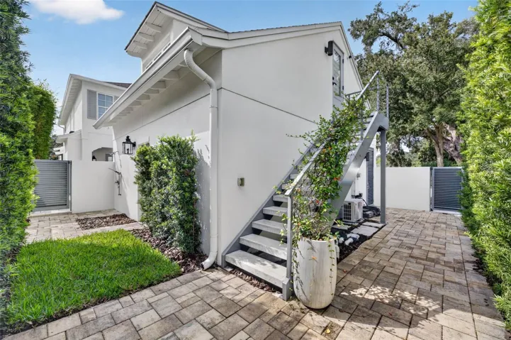 Outdoor shower and upgraded concrete stairs with powder-coated aluminum railings