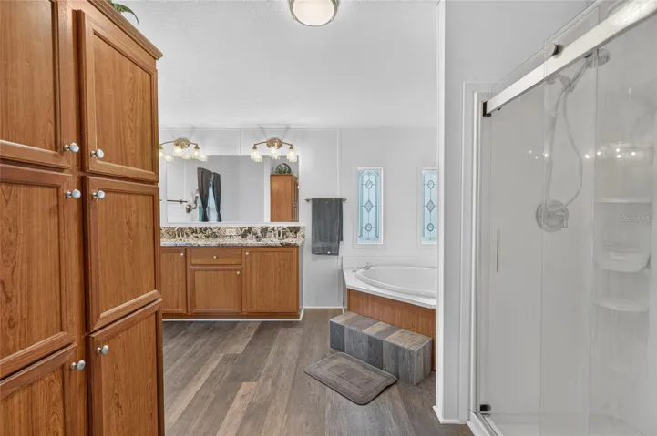 Primary bathroom, lots of cabinets for storage