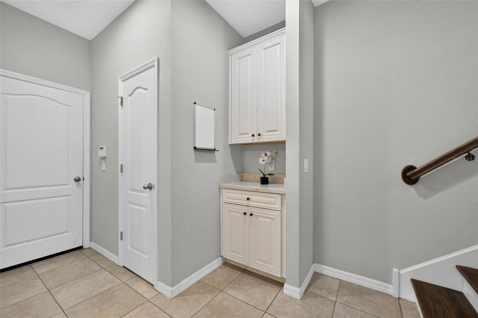 Drop zone on the first floor, by closet and garage entry door.