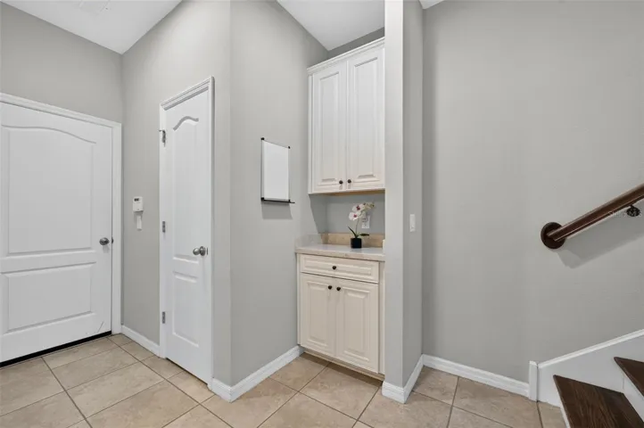 Drop zone on the first floor, by closet and garage entry door.