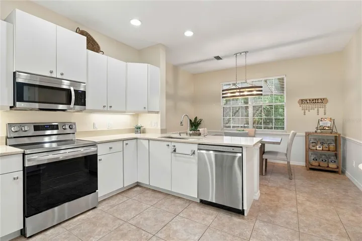 Kitchen with quartz counters and 2024 appliances