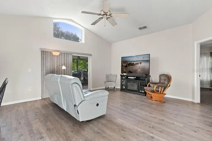 Living room with sliding glass doors leading to porch