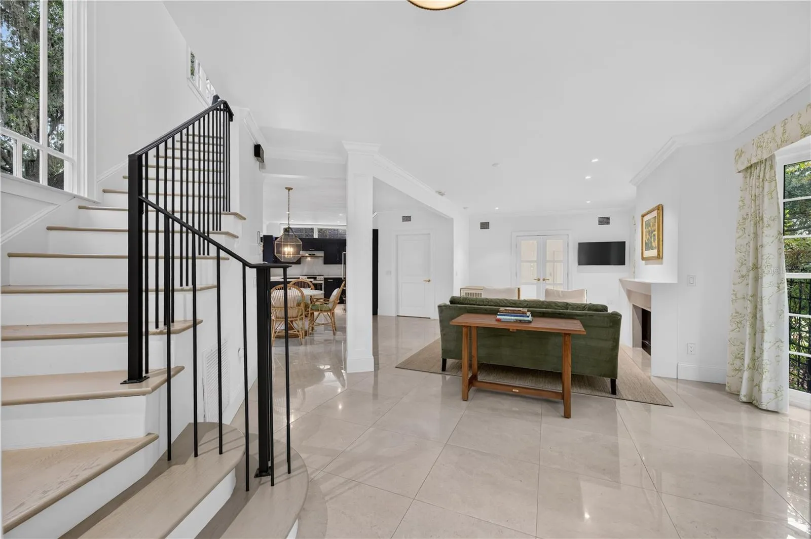 Entryway overlooking living, dining and kitchen areas