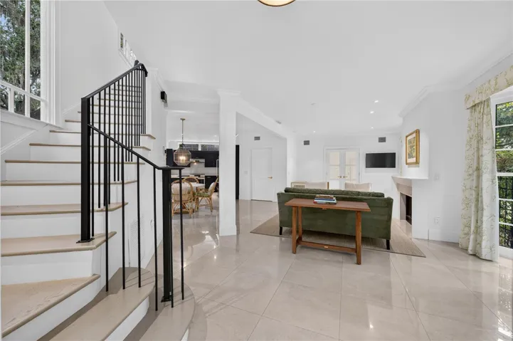 Entryway overlooking living, dining and kitchen areas