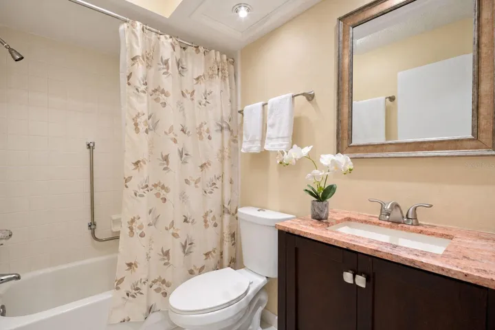 Updated hall bath is tucked between the main living &amp; guest suite~