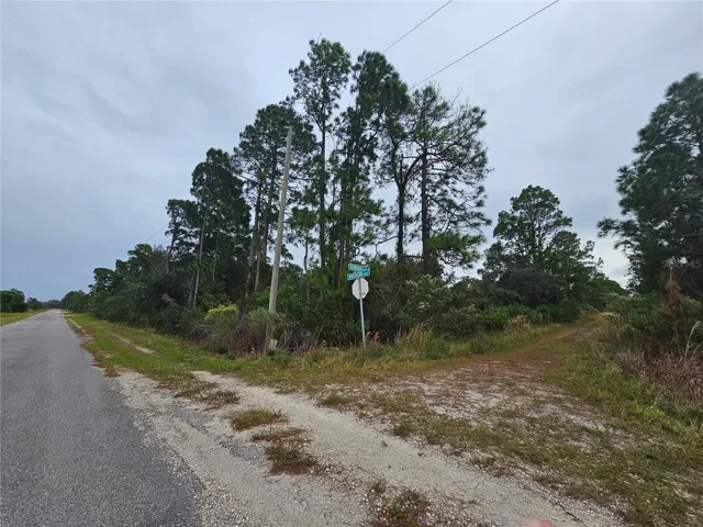 Paved road on 1 side, dirt road on the front side.