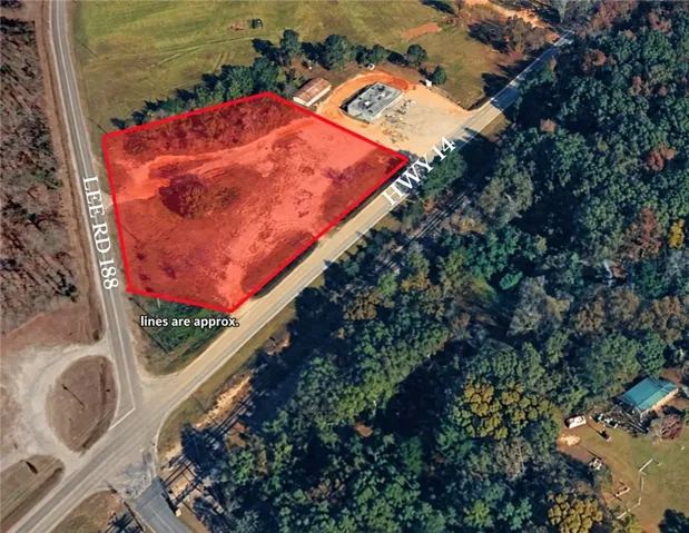 A prime corner lot with exceptional visibility borders two prominent roadways.