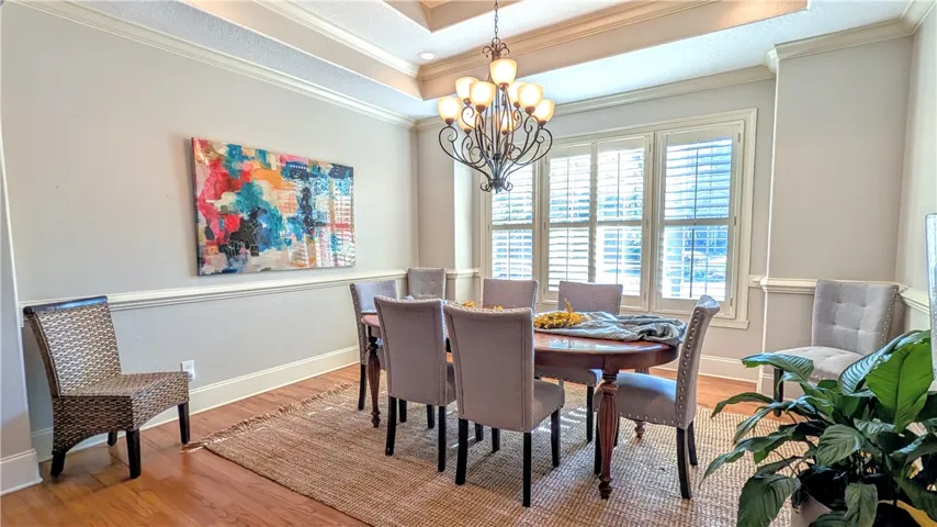 Formal dining with tray ceilings.