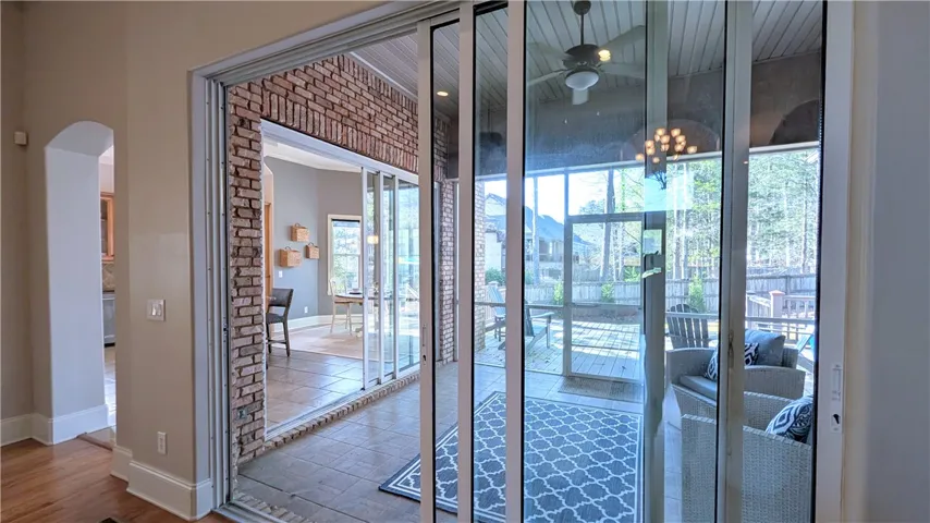 Triple glass sliders from great room to porch