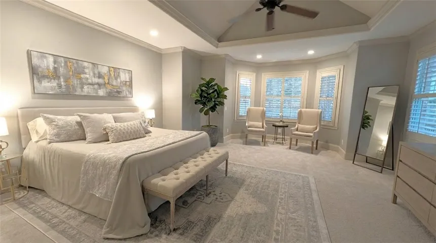 Primary bedroom with seating area