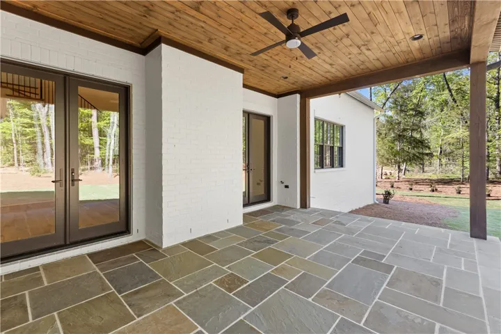This expansive patio provides an ideal setting for serene outdoor living and entertaining.
