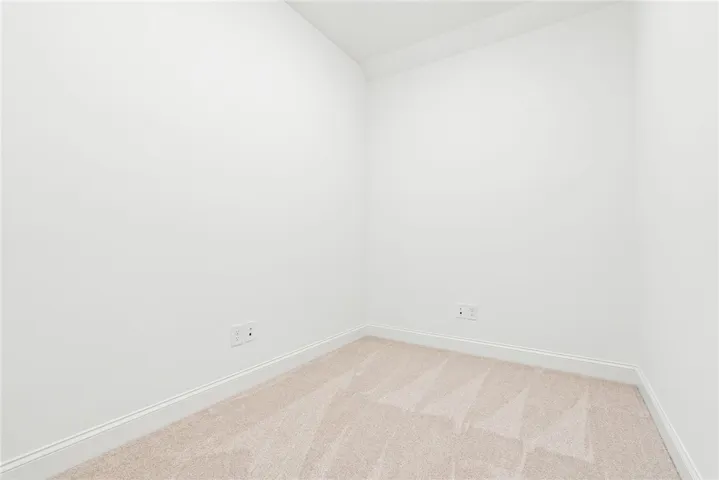 This versatile room offers plush carpet and pristine walls, ready for your personal touch.